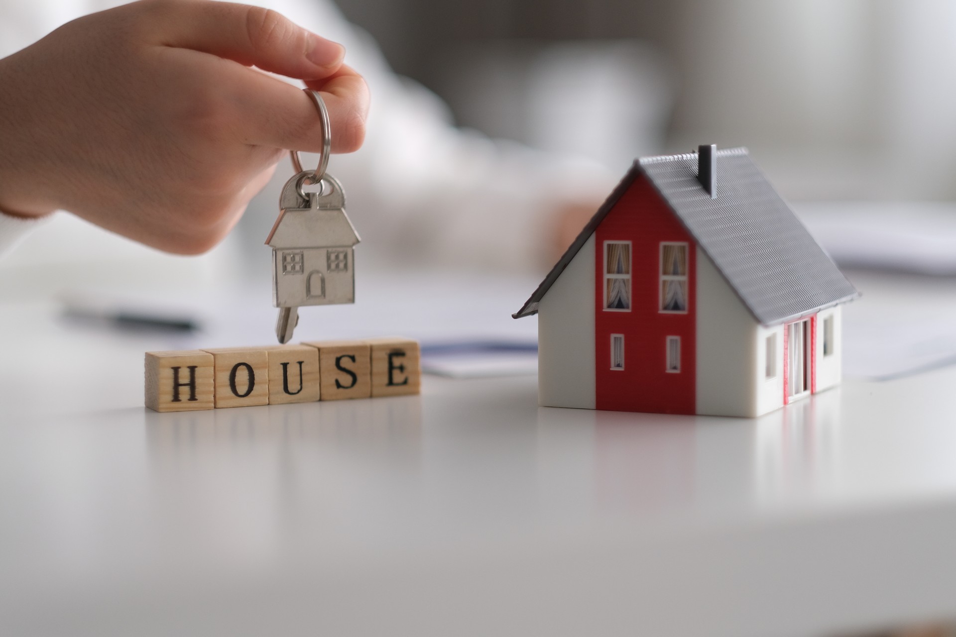 Real estate agent giving house keys Real estate agent giving house keys